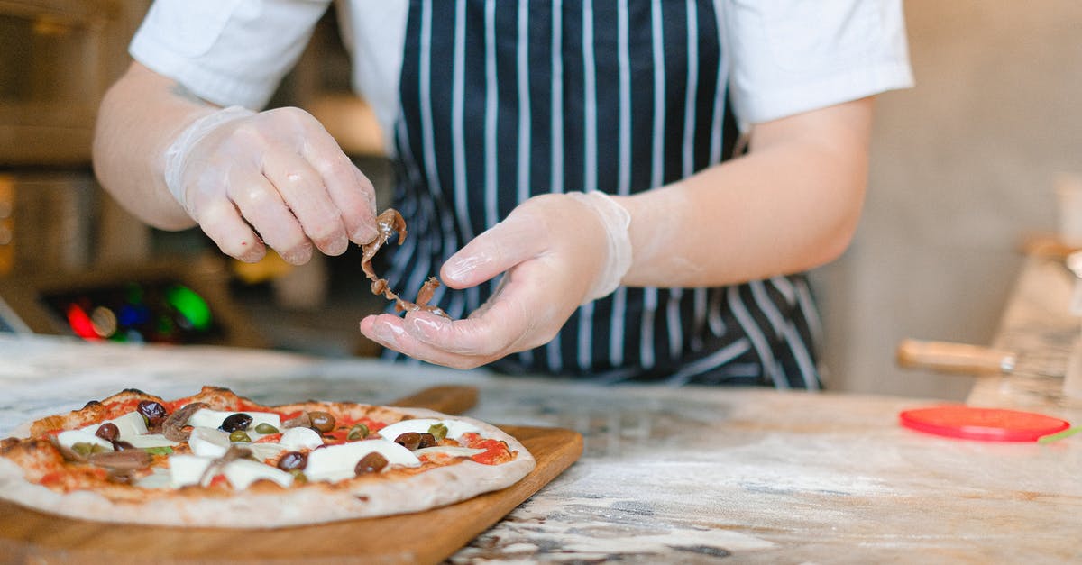 What is the best flour to use for pizza dough? - Person Preparing A Pizza What is the best flour to use for pizza dough? - Person Preparing A Pizza