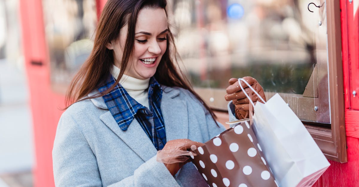 What is the coating of this spring roll called, and how is it made? - Happy young brunette wearing blue coat looking in shopping bags while standing on city street on sunny spring day What is the coating of this spring roll called, and how is it made? - Happy young brunette wearing blue coat looking in shopping bags while standing on city street on sunny spring day