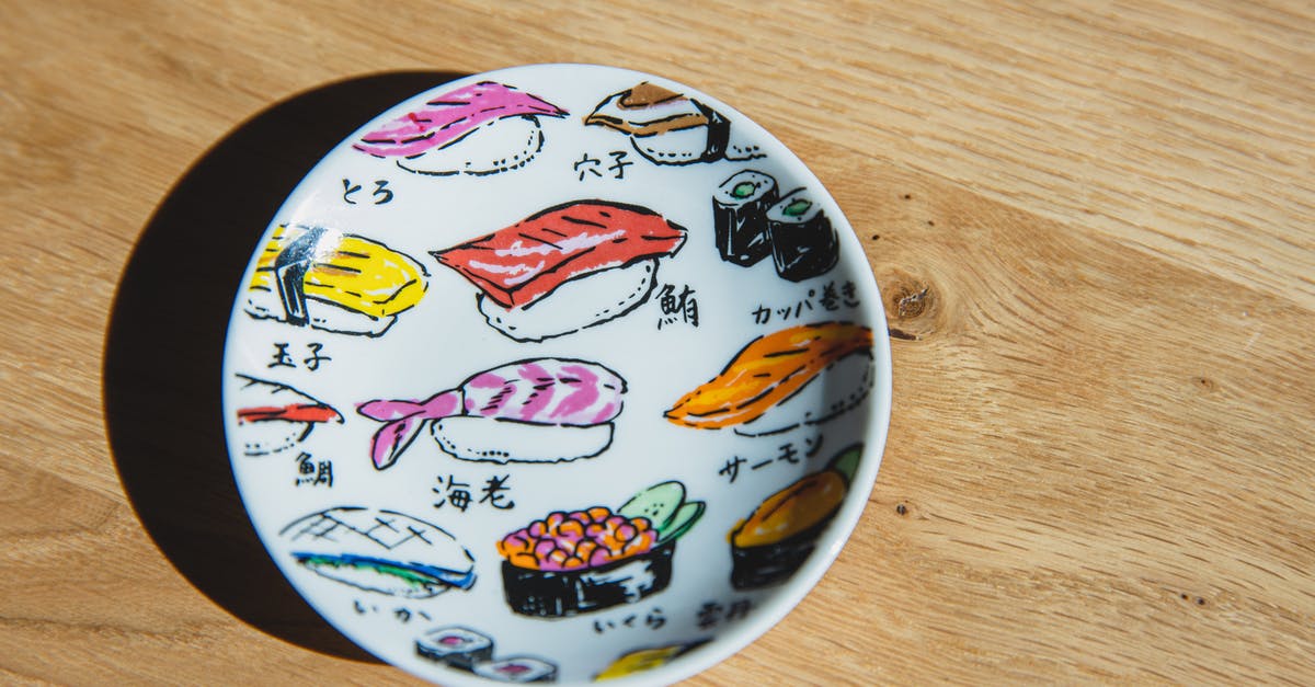 What is the difference between Alaskan King Salmon and Scottish Salmon? - Top view of white ceramic plate with colorful drawings of sushi and rolls placed on wooden table What is the difference between Alaskan King Salmon and Scottish Salmon? - Top view of white ceramic plate with colorful drawings of sushi and rolls placed on wooden table