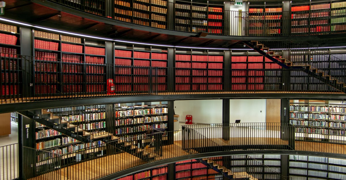 What is the difference between Clam Chowder and New England style? - Interior of library with bookshelves