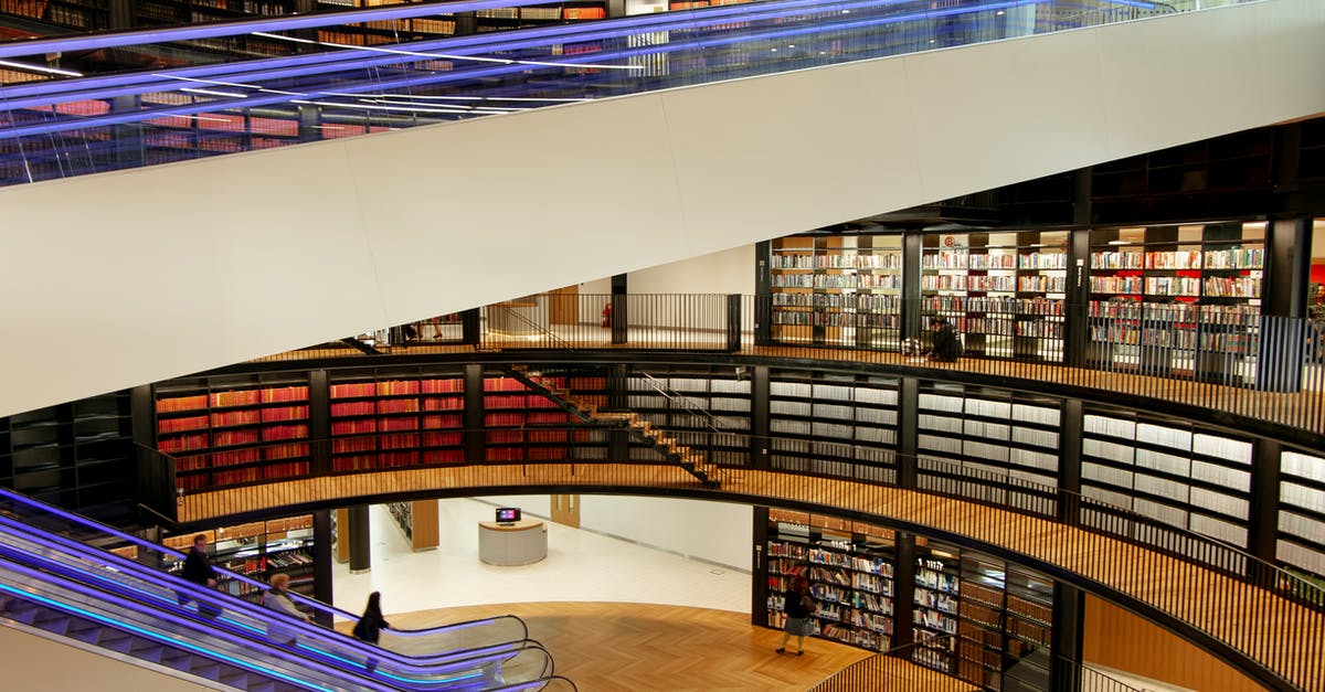 What is the difference between Clam Chowder and New England style? - Interior of modern library with escalators