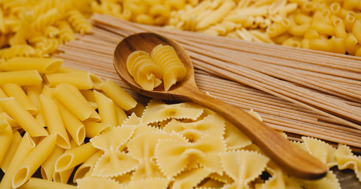 What is the difference between cracked wheat and wheatgerm? - Different types of raw pasta with wooden spoon What is the difference between cracked wheat and wheatgerm? - Different types of raw pasta with wooden spoon