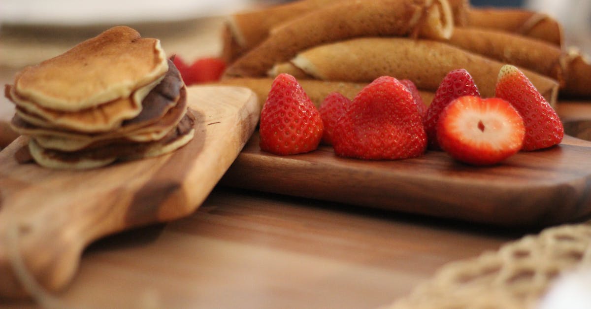 What is the difference between crepes and Swedish pancakes? - Strawberry Fruit on Brown Wooden Board What is the difference between crepes and Swedish pancakes? - Strawberry Fruit on Brown Wooden Board