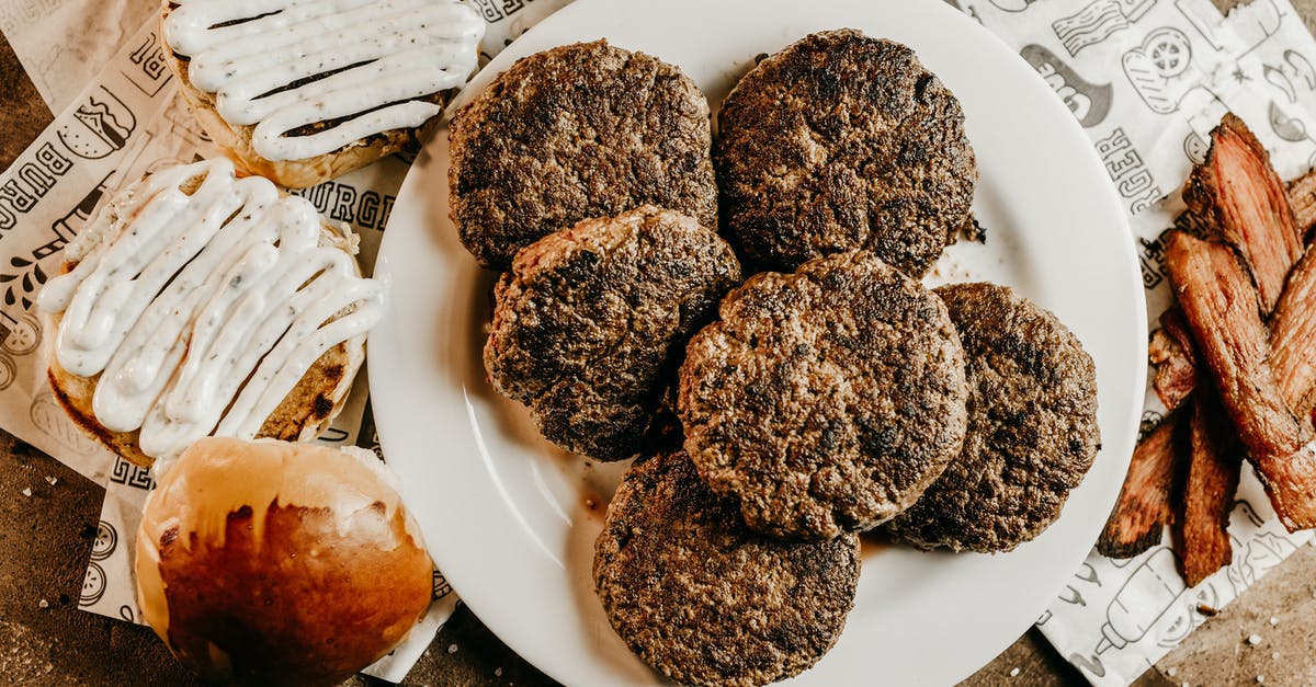 What is the difference between roasting, baking, and broasting? - Delicious burgers and buns on table What is the difference between roasting, baking, and broasting? - Delicious burgers and buns on table