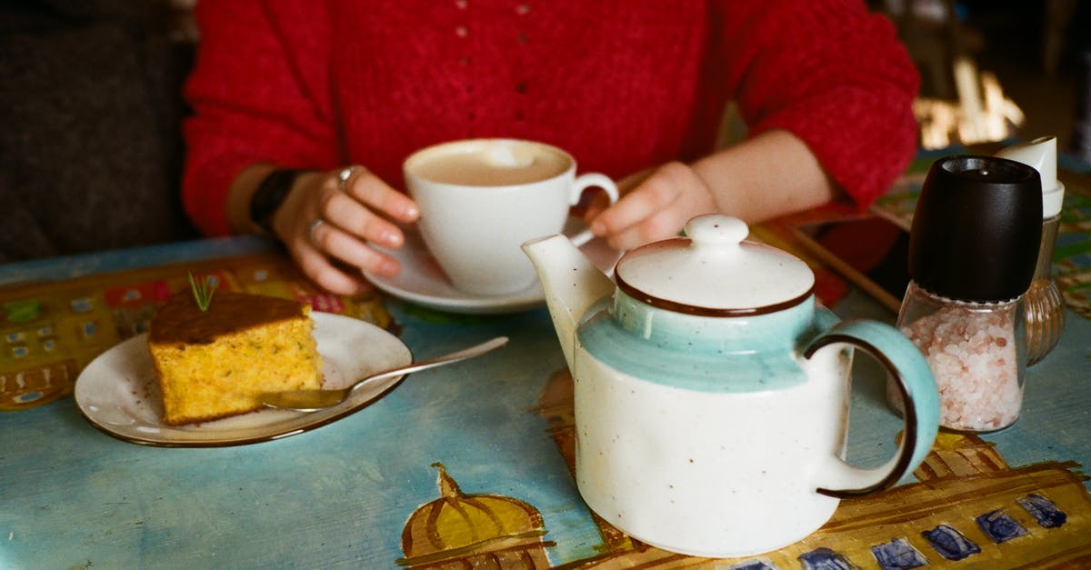 What is the difference between sea salt and regular table salt? - Unrecognizable woman with coffee and delicious cake in cafe What is the difference between sea salt and regular table salt? - Unrecognizable woman with coffee and delicious cake in cafe