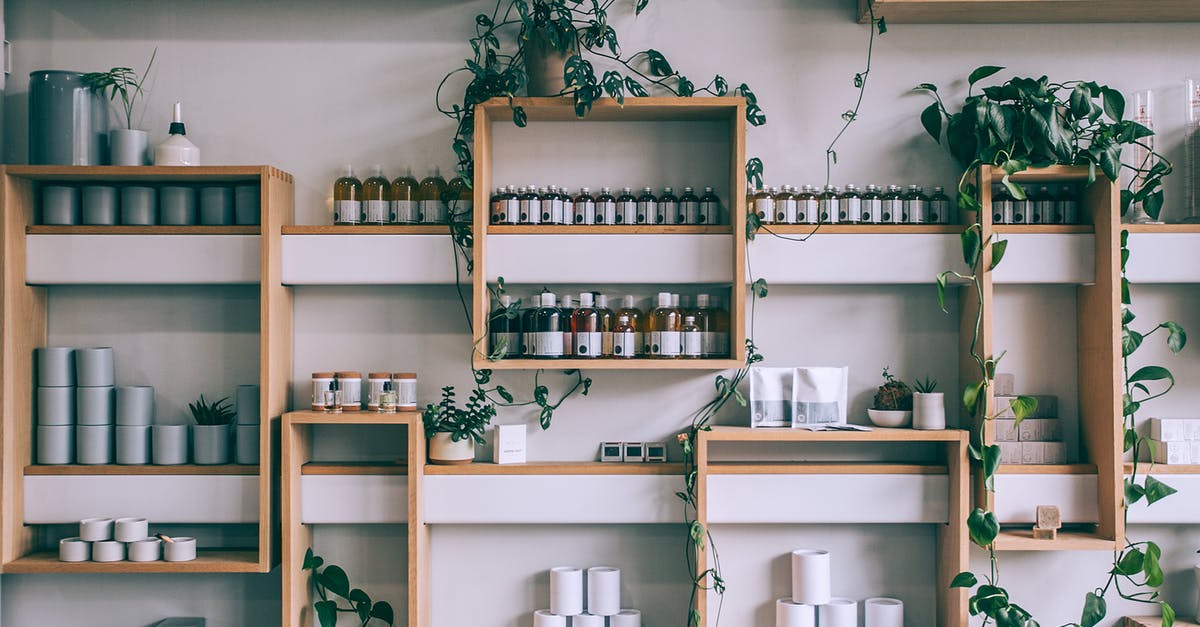 What is the difference between small vs large loose leaf tea? - Creative interior design of small shop with wooden shelves full of assorted colorful bottles and green plants What is the difference between small vs large loose leaf tea? - Creative interior design of small shop with wooden shelves full of assorted colorful bottles and green plants
