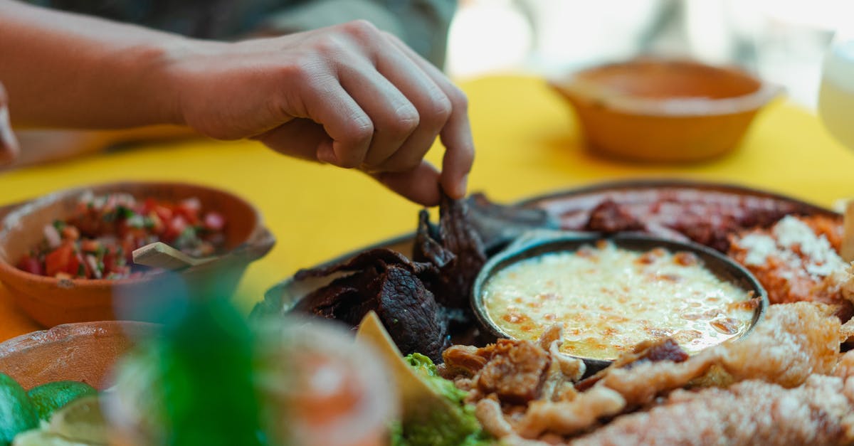 What is the difference between traditional Mexican cooking and Tex-Mex? - Person Eating Mexican Food What is the difference between traditional Mexican cooking and Tex-Mex? - Person Eating Mexican Food
