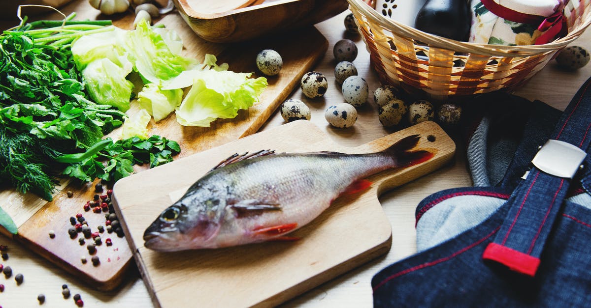 What is the difference between various cuts of steak? - Raw fish on cutting board with lettuce in kitchen What is the difference between various cuts of steak? - Raw fish on cutting board with lettuce in kitchen