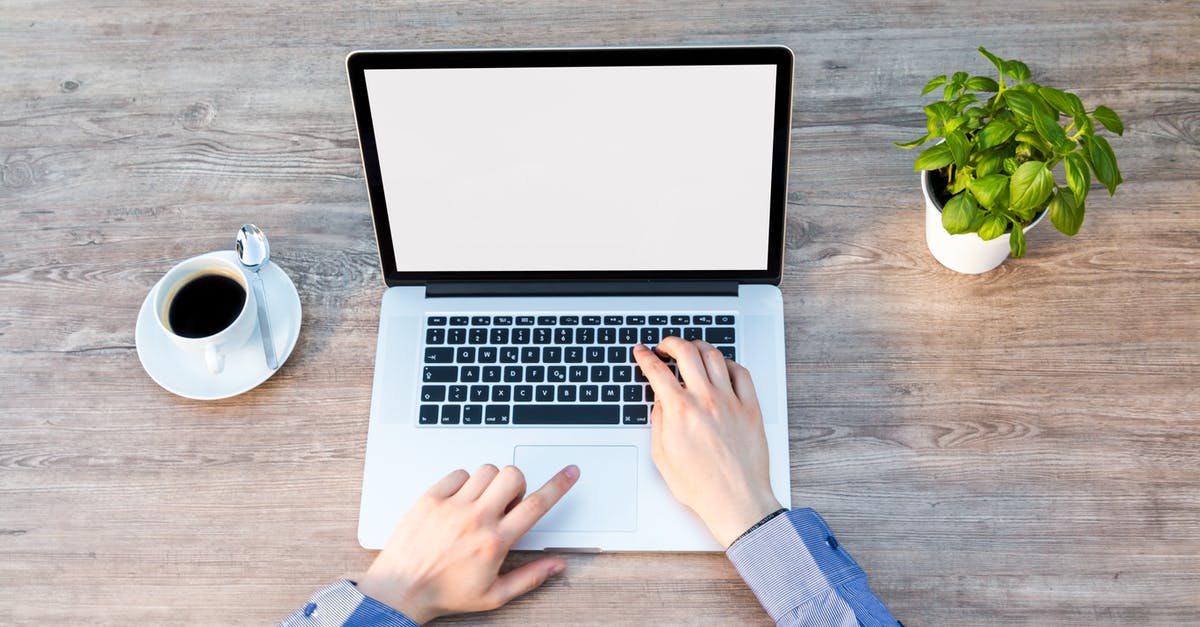 What is the film on top of tea? - Person's Hand on Laptop What is the film on top of tea? - Person's Hand on Laptop