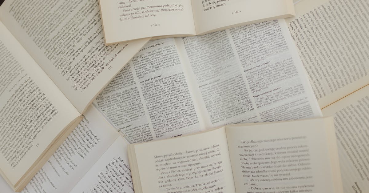 What is the history of the standard sheet (bun) pan? - From above of opened books with white pages placed above each other in library What is the history of the standard sheet (bun) pan? - From above of opened books with white pages placed above each other in library