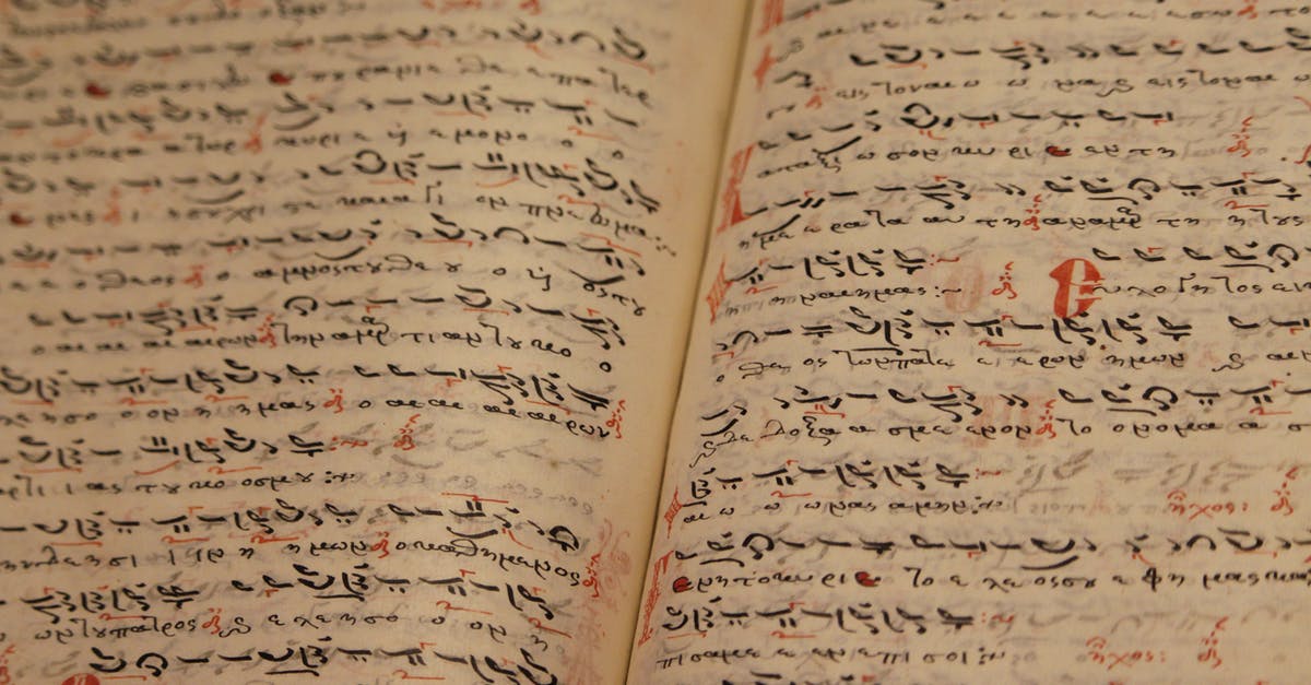 What is the history of the standard sheet (bun) pan? - Opened book with Arabic lettering on sheets What is the history of the standard sheet (bun) pan? - Opened book with Arabic lettering on sheets