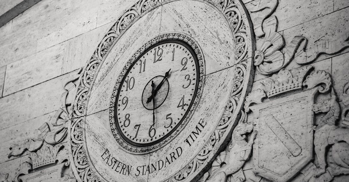What is the history of the standard sheet (bun) pan? - From below black and white of stone wall with ornamental details around clock showing Eastern Standard Time What is the history of the standard sheet (bun) pan? - From below black and white of stone wall with ornamental details around clock showing Eastern Standard Time