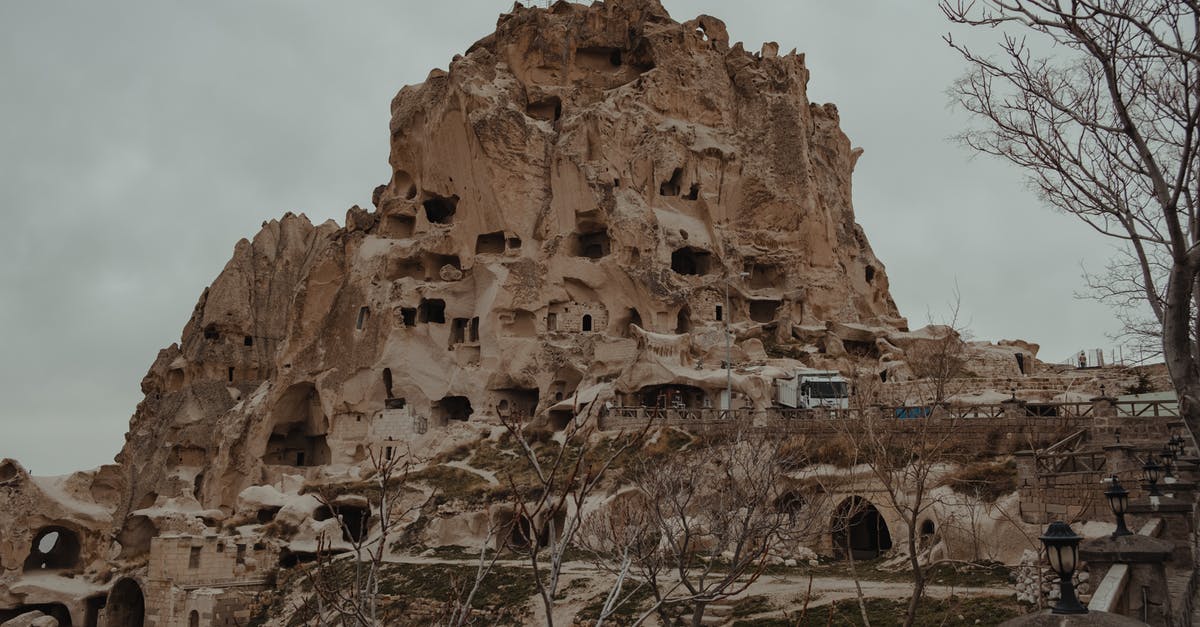 What is the hole in this turkey? - Mountain with carved houses in national park What is the hole in this turkey? - Mountain with carved houses in national park