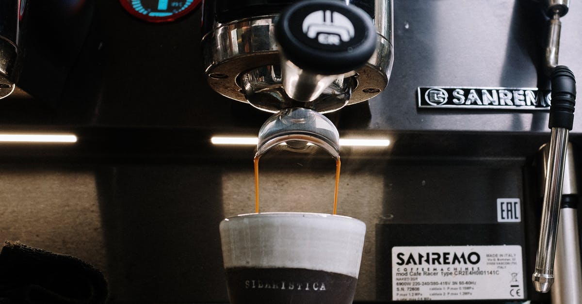 What is the ideal grind for making espresso? - White Disposable Cup on Black and Silver Coffee Maker What is the ideal grind for making espresso? - White Disposable Cup on Black and Silver Coffee Maker