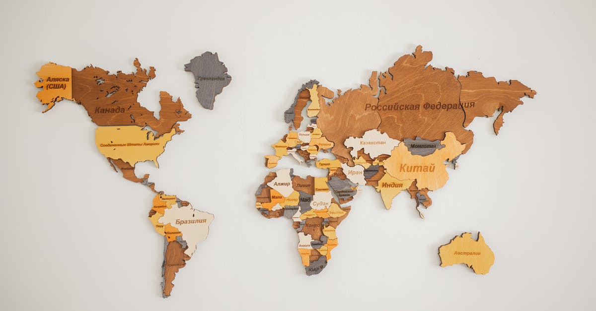 What is the name of this style of knife? - Decorative creative wooden world continents with country names written in Cyrillic attached on white background in light room of studio What is the name of this style of knife? - Decorative creative wooden world continents with country names written in Cyrillic attached on white background in light room of studio