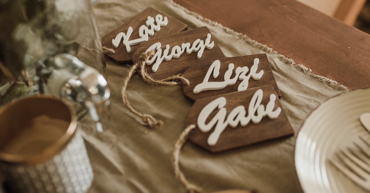 What is the name of this style of knife? - Wooden name tags arranged on table during wedding ceremony What is the name of this style of knife? - Wooden name tags arranged on table during wedding ceremony
