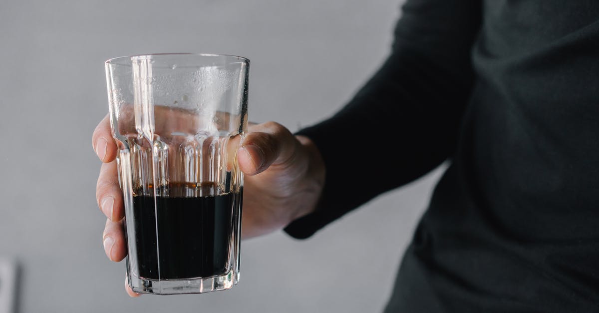 What is the optimal steep time for cold-brewed coffee? - Person Holding Clear Shot Glass With Black Liquid What is the optimal steep time for cold-brewed coffee? - Person Holding Clear Shot Glass With Black Liquid