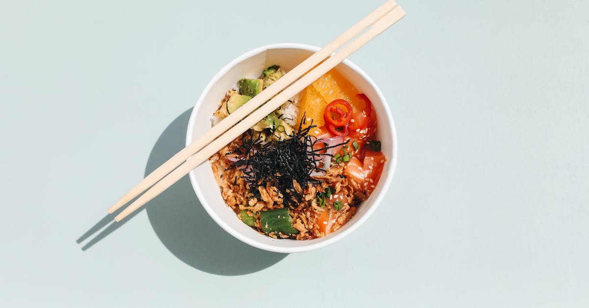 What is the origin of spam musubi, a Hawaiian dish? - Photo of Wooden Chopsticks on a Poke Bowl What is the origin of spam musubi, a Hawaiian dish? - Photo of Wooden Chopsticks on a Poke Bowl