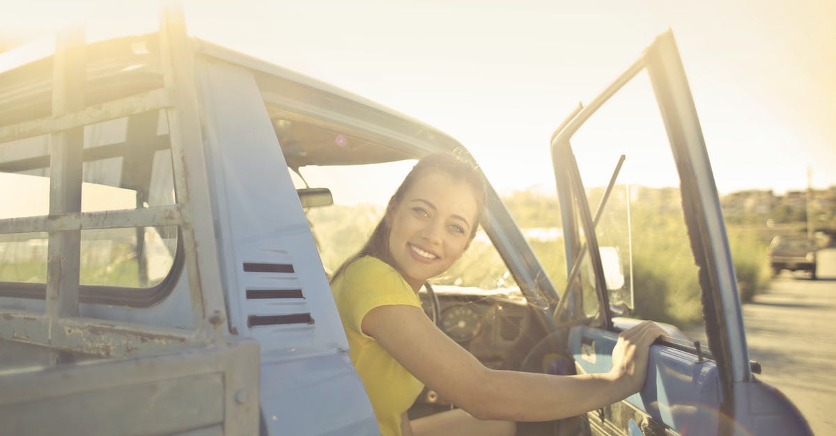 What is the proper way to maintain a can opener? - Woman Peeking Inside the Pickup Truck What is the proper way to maintain a can opener? - Woman Peeking Inside the Pickup Truck
