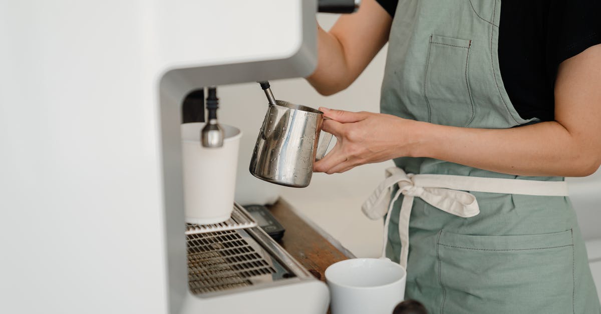 What is the proper way to make a cup of mate? - Crop barista preparing coffee in cafe What is the proper way to make a cup of mate? - Crop barista preparing coffee in cafe