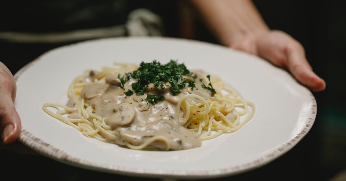 What is the purpose of heavy cream in a mushroom duxelle? - Crop unrecognizable woman serving plate of scrumptious spaghetti What is the purpose of heavy cream in a mushroom duxelle? - Crop unrecognizable woman serving plate of scrumptious spaghetti