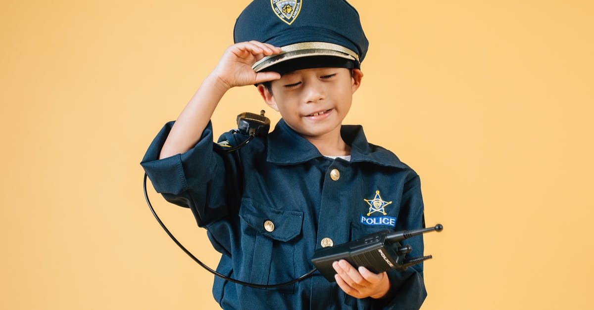 What is the purpose of raita? - Ethnic kid in police uniform in studio What is the purpose of raita? - Ethnic kid in police uniform in studio