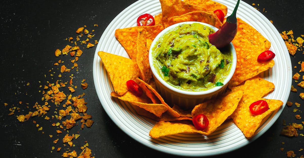 What is the "Chili sauce" ingredient in this recipe? - From above arrangement of yummy guacamole bowl surrounded with crispy nachos and decorated with chili pepper while served on black table What is the "Chili sauce" ingredient in this recipe? - From above arrangement of yummy guacamole bowl surrounded with crispy nachos and decorated with chili pepper while served on black table