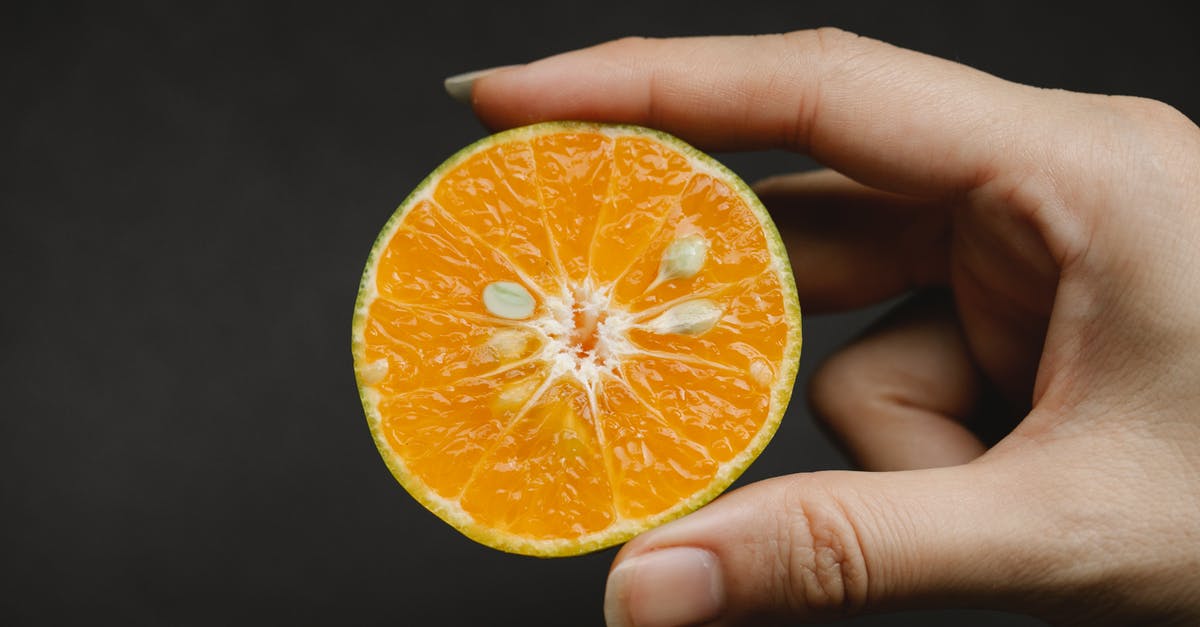 What is the rate of loss of vitamin C in fresh vegetables? - Crop anonymous female demonstrating fresh juicy fruit containing vitamins and macroelement for healthy lifestyle on black background What is the rate of loss of vitamin C in fresh vegetables? - Crop anonymous female demonstrating fresh juicy fruit containing vitamins and macroelement for healthy lifestyle on black background