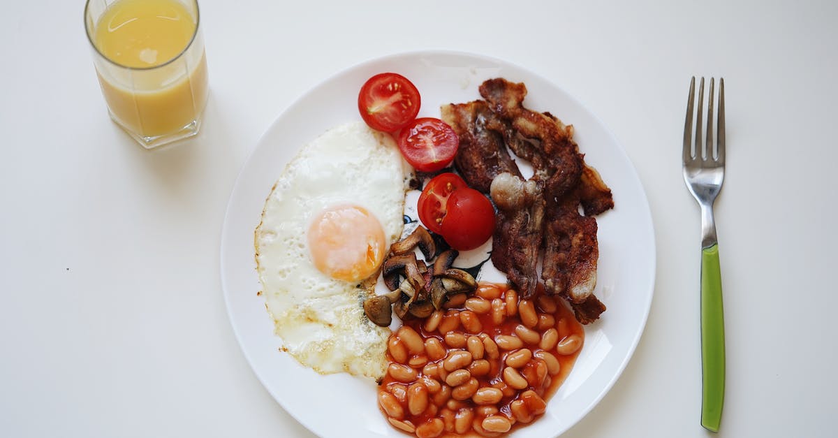 What is the ratio of tomatos/onions to egg when making omlette? - Woman rolling dough on table with tomatoes and eggs What is the ratio of tomatos/onions to egg when making omlette? - Woman rolling dough on table with tomatoes and eggs
