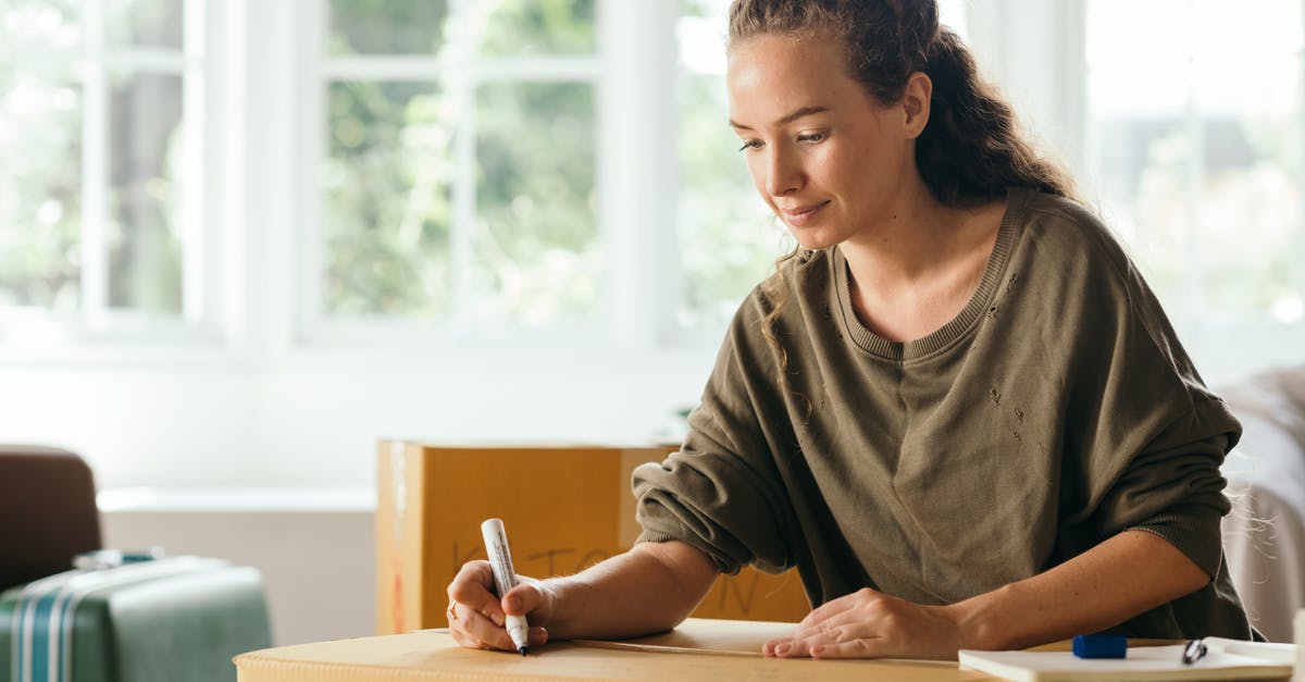 What is the stringy slimy stuff in Peace Tea? - Calm lady sitting on sofa and signing box with belongings in cozy house in sunny day while moving out What is the stringy slimy stuff in Peace Tea? - Calm lady sitting on sofa and signing box with belongings in cozy house in sunny day while moving out