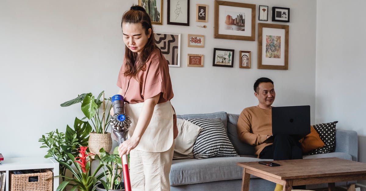 What is the technique for Vacuum Flask Cooking? - Woman in White Dress Standing Beside Woman in Gray Dress Sitting on Couch What is the technique for Vacuum Flask Cooking? - Woman in White Dress Standing Beside Woman in Gray Dress Sitting on Couch