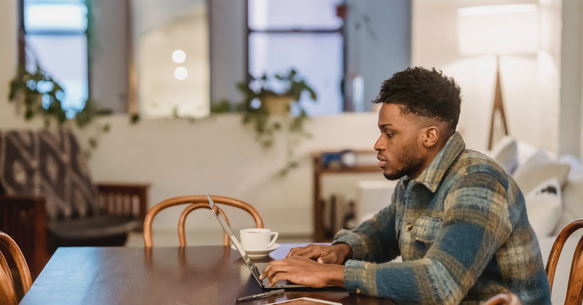 What is the term used for this type of biscuit - Concentrated black man working on laptop at home office What is the term used for this type of biscuit - Concentrated black man working on laptop at home office