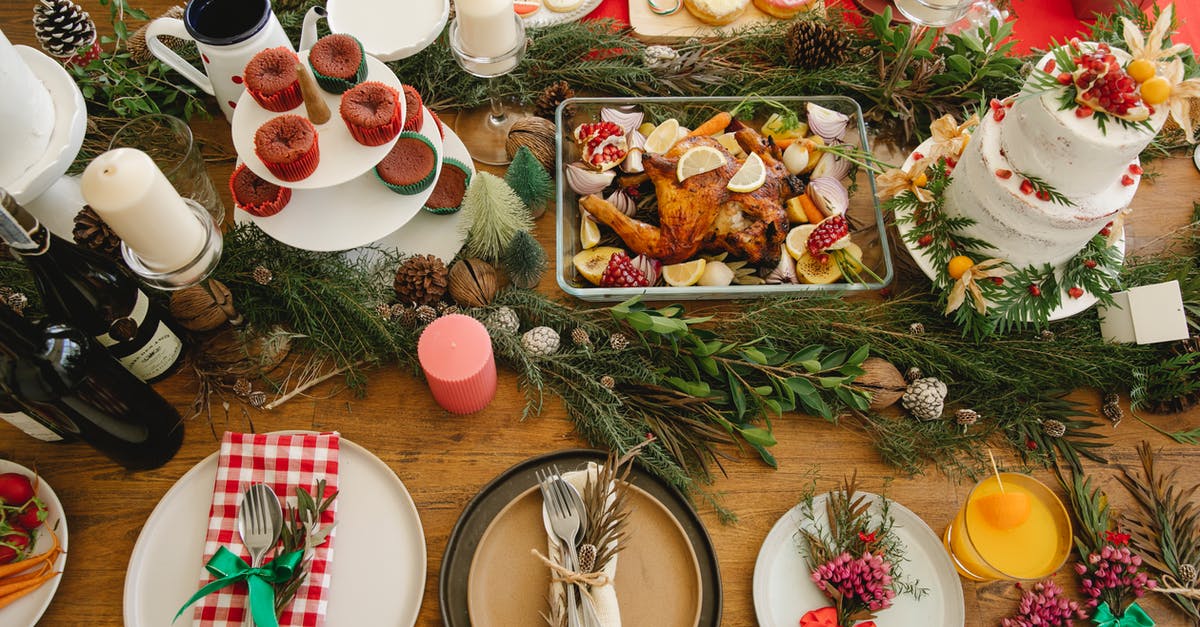 What is the traditional accompaniment for Duck Confit? - Served table with plates and festive food What is the traditional accompaniment for Duck Confit? - Served table with plates and festive food