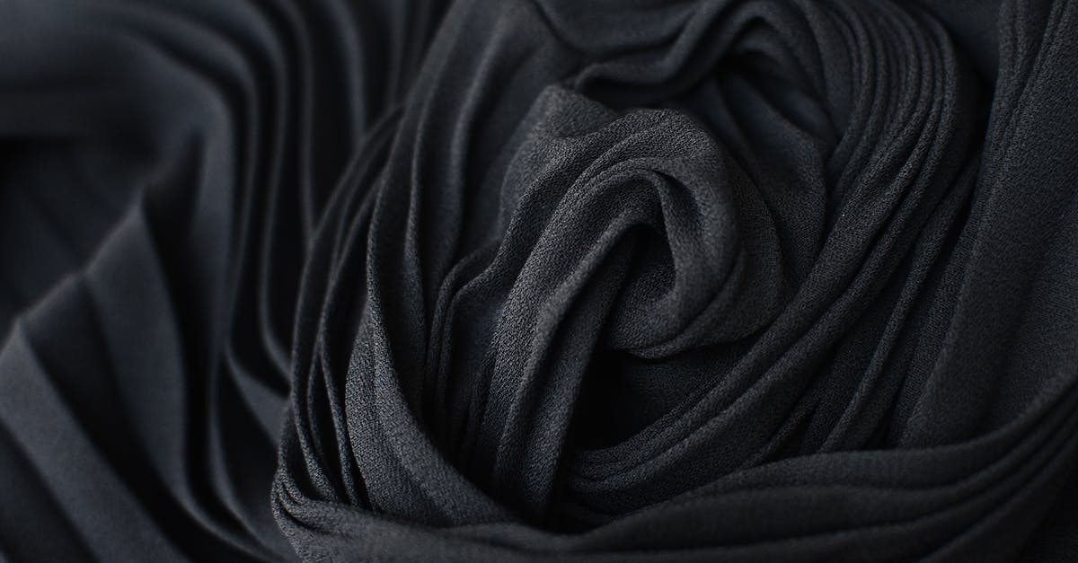 What is this colored fiber in my chicken? - Abstract background of black fabric on table What is this colored fiber in my chicken? - Abstract background of black fabric on table