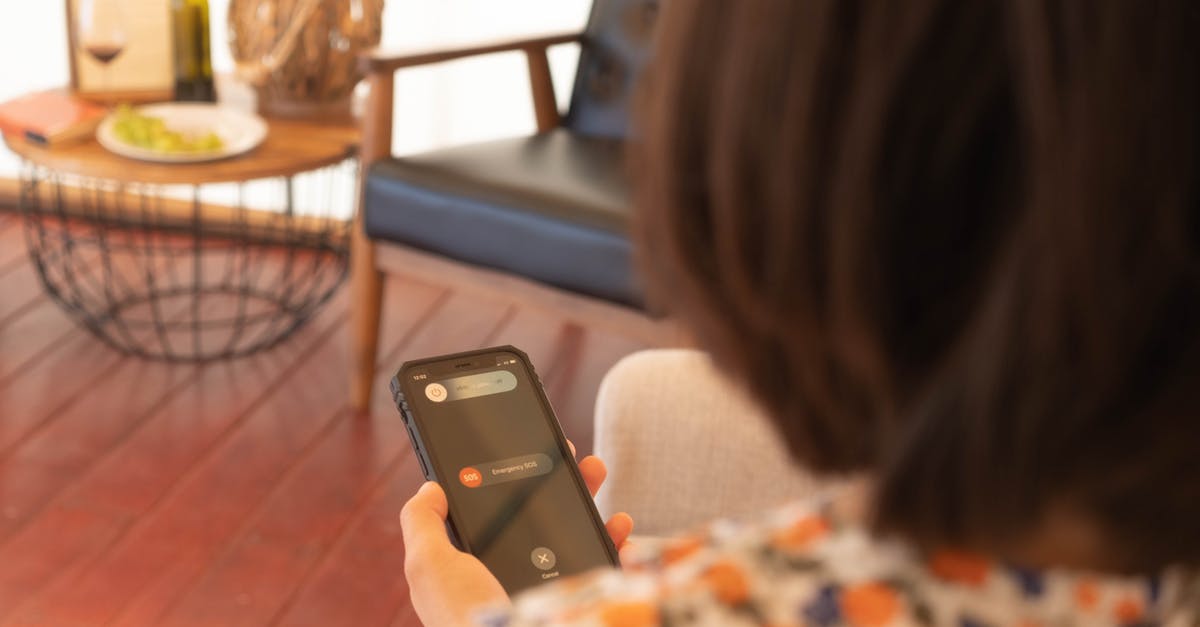 What is this device? - Woman Holding Black Iphone 5 What is this device? - Woman Holding Black Iphone 5