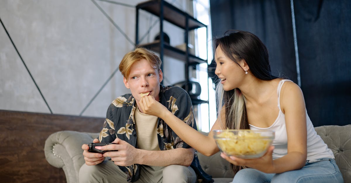 What is this food? - Woman in White Tank Top Sitting on Mans Lap