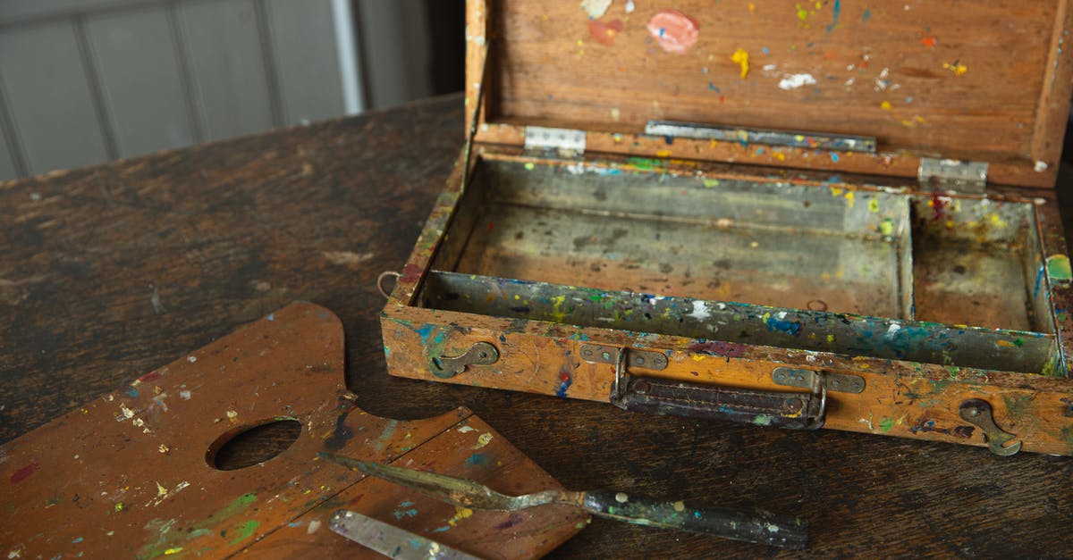 What is this odd tool used for? - Aged wooden palette with spatulas on shabby table What is this odd tool used for? - Aged wooden palette with spatulas on shabby table