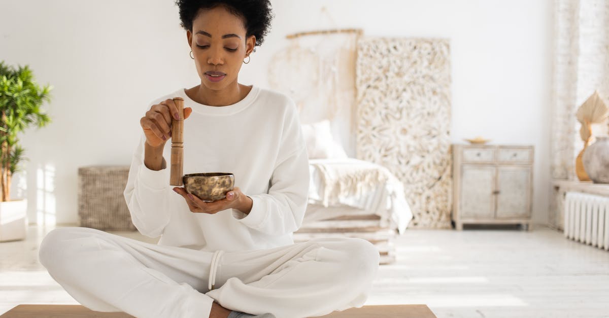What is this Tibetan dessert? - A Woman Using a Singing Bowl while Sitting What is this Tibetan dessert? - A Woman Using a Singing Bowl while Sitting
