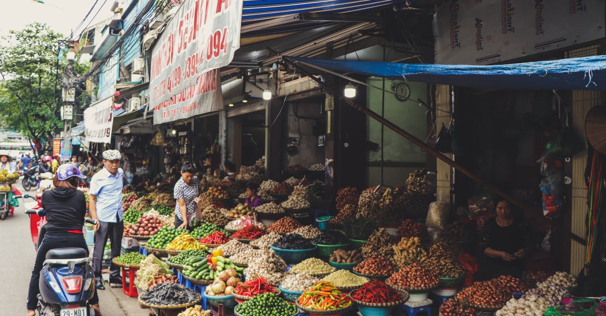 What is this Vietnamese Food? - Person in Scooter in Front of Vegetables What is this Vietnamese Food? - Person in Scooter in Front of Vegetables