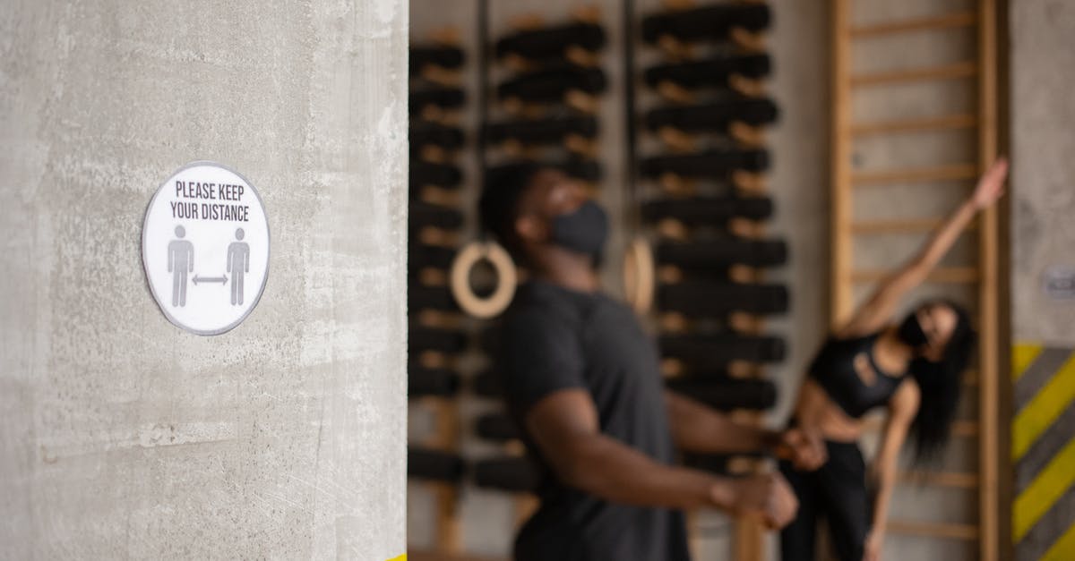 What is your training regimen for developing your palate? - Distance sign in gym with unrecognizable black sportspeople during workout What is your training regimen for developing your palate? - Distance sign in gym with unrecognizable black sportspeople during workout