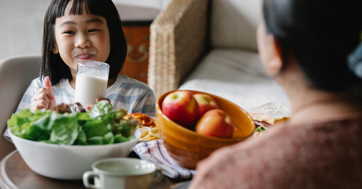 What kind of apple fermented drink did I just make? - Happy Asian little girl drinking milk while smiling What kind of apple fermented drink did I just make? - Happy Asian little girl drinking milk while smiling