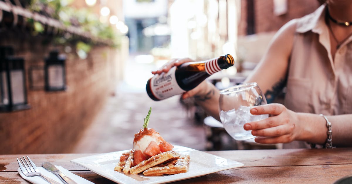 What kind of beer for beer brats? - Person Pouring Wine on Brown Wooden Table What kind of beer for beer brats? - Person Pouring Wine on Brown Wooden Table