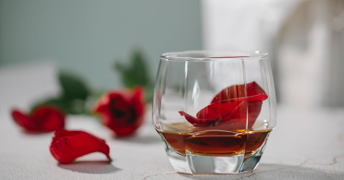 What kind of bourbon is best for making whiskey balls? - Glass of alcoholic drink with petals What kind of bourbon is best for making whiskey balls? - Glass of alcoholic drink with petals