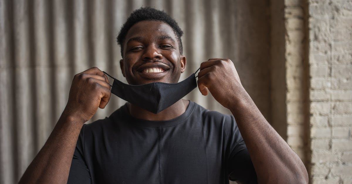 What kind of frosting doesn't need to be refrigerated? - Cheerful black man with fabric mask against ribbed wall What kind of frosting doesn't need to be refrigerated? - Cheerful black man with fabric mask against ribbed wall