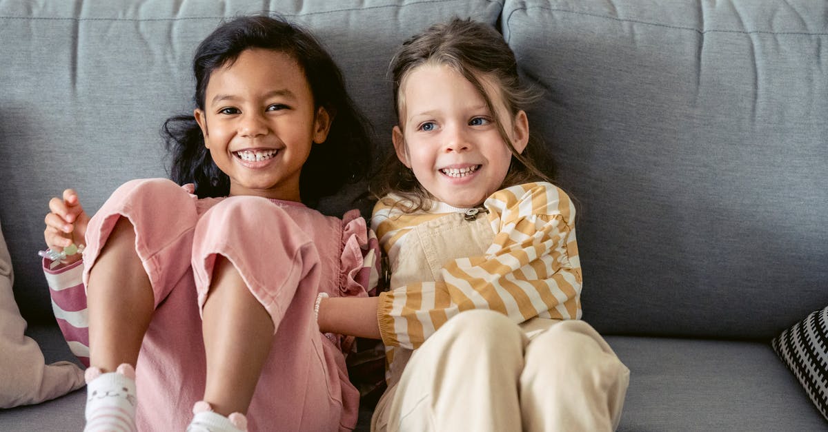 What kind of pan works best with a waterbath? - Cheerful best multiracial friends in striped clothes interacting on couch in living room in house What kind of pan works best with a waterbath? - Cheerful best multiracial friends in striped clothes interacting on couch in living room in house