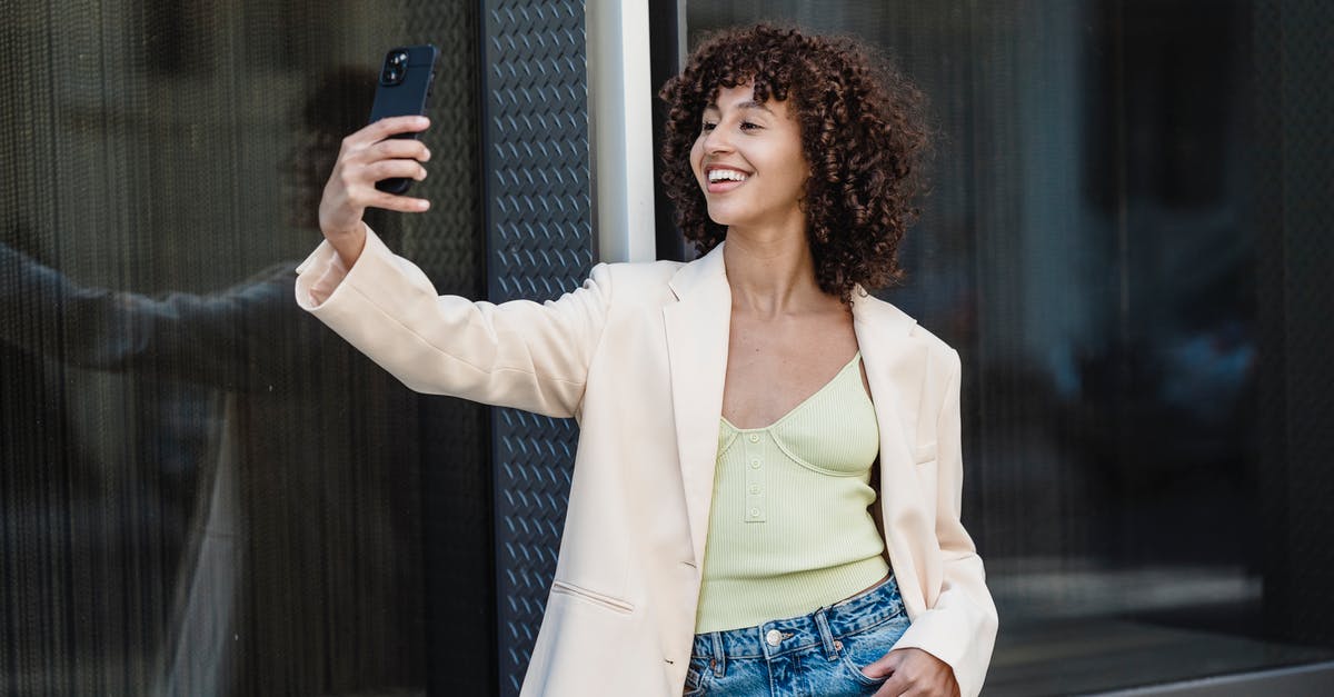 What kind of peppers are used in Gochugaru (고추가루)? - Positive ethnic woman taking self portrait on smartphone in town What kind of peppers are used in Gochugaru (고추가루)? - Positive ethnic woman taking self portrait on smartphone in town