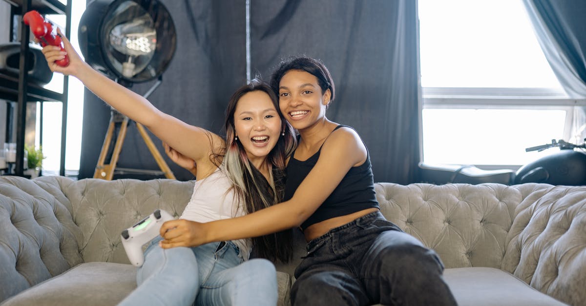 What kind of reaction is this? - Woman in Gray Tank Top Sitting Beside Woman in Gray Tank Top What kind of reaction is this? - Woman in Gray Tank Top Sitting Beside Woman in Gray Tank Top