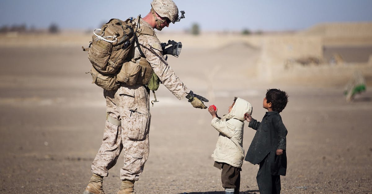 What kind of yeast is this? - Soldier Giving Red Fruit on 2 Children during Daytime What kind of yeast is this? - Soldier Giving Red Fruit on 2 Children during Daytime