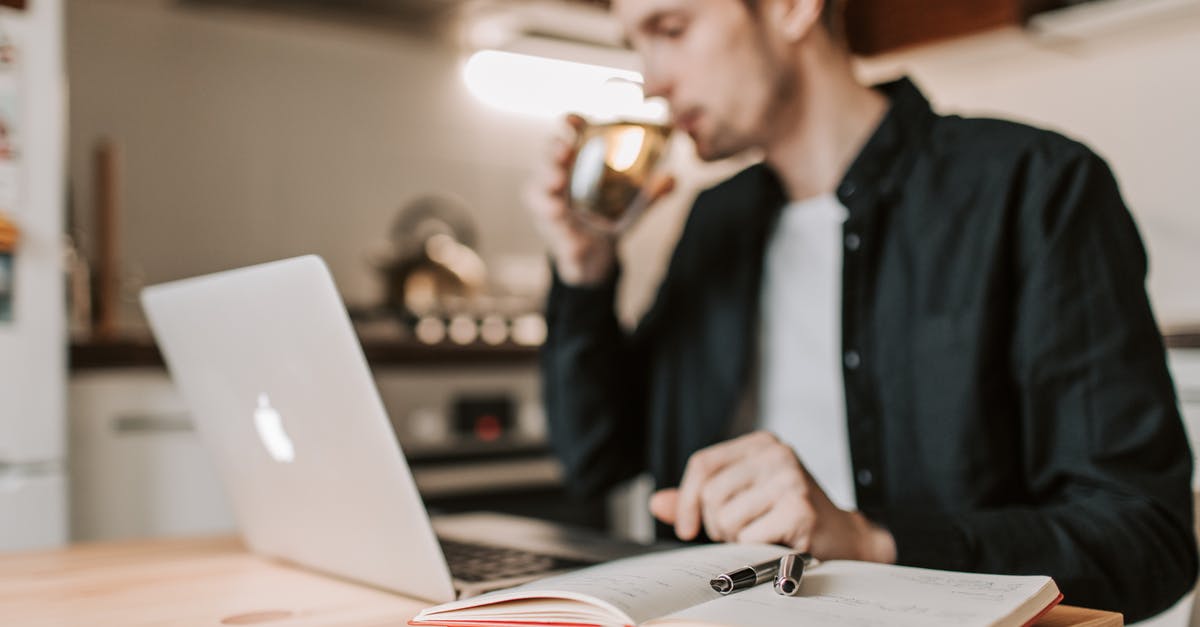 What knives are "required" for a serious home kitchen? - Crop male freelancer drinking water while watching laptop in kitchen What knives are "required" for a serious home kitchen? - Crop male freelancer drinking water while watching laptop in kitchen