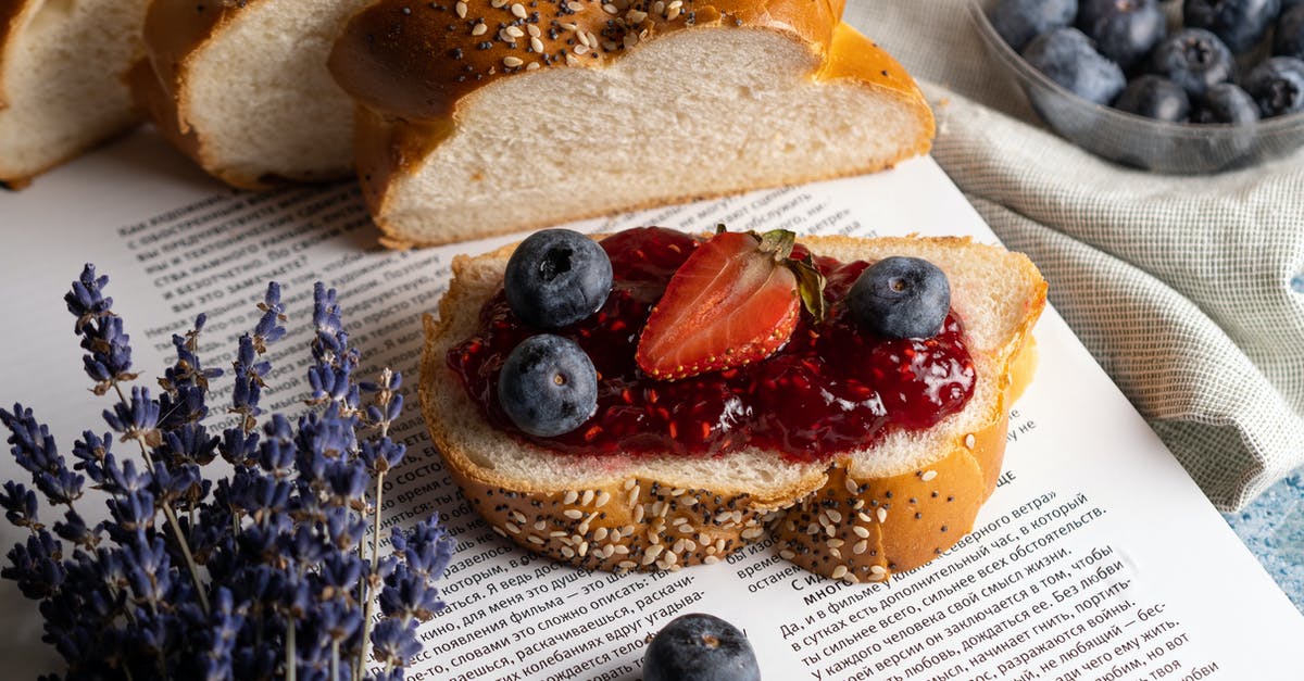 What makes a bread either close or open crumbed/textured? - Fresh Slice of Bread with Jam and Fruits Lying on Open Book What makes a bread either close or open crumbed/textured? - Fresh Slice of Bread with Jam and Fruits Lying on Open Book
